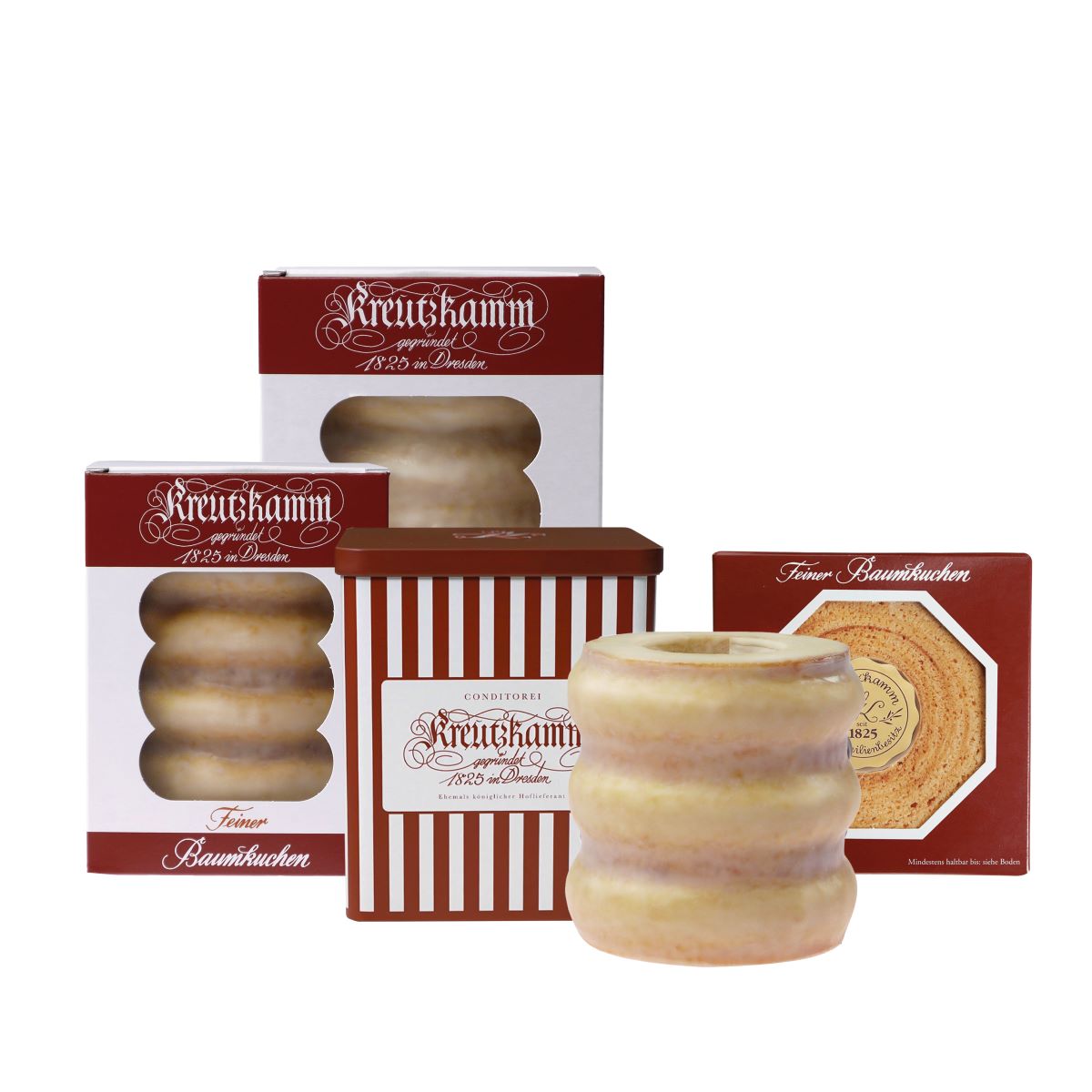BK-Gruppe_glasiert_2024tUlZWX649Vijw Kuchen in verschiedenen Verpackungen. Einzeln stehender Kuchen neben drei Verpackungen. Alle Verpackungen tragen 'Kreutzkamm' Aufschrift und enthalten Sichtfenster oder Fotos.