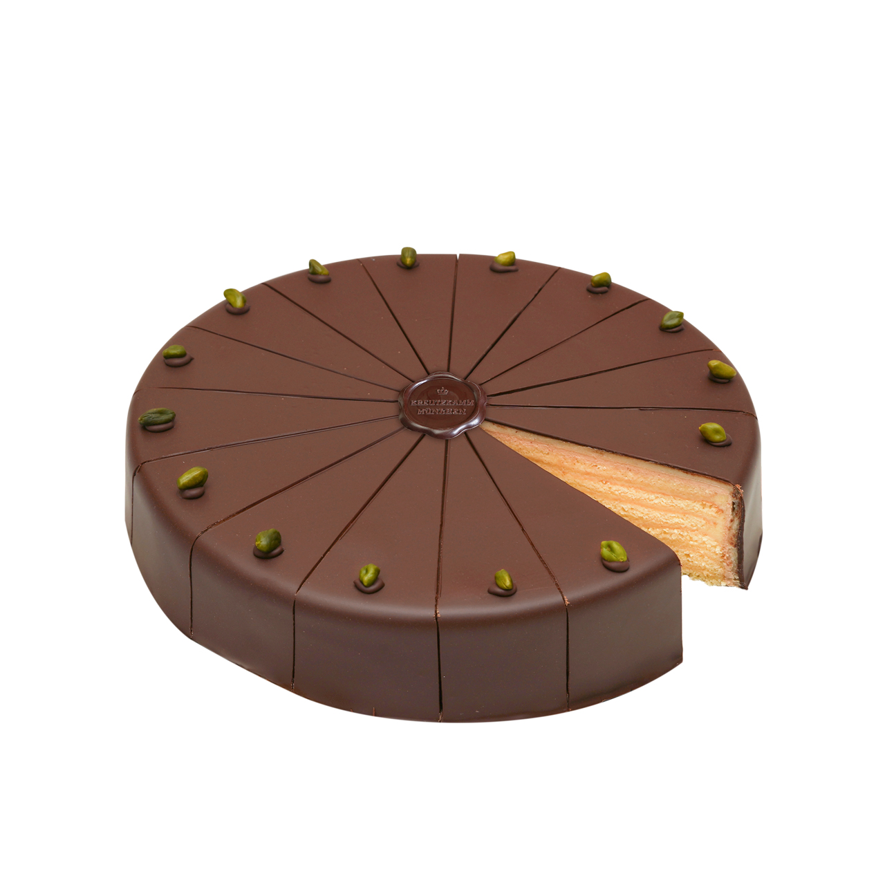 Herren-Torte-gross-Schnitt Kuchen mit Schokoladenglasur und Pistazien, ein Stueck fehlt. Text: Backhaus Kreutzkamm.